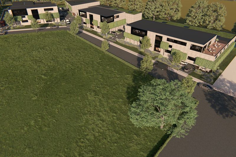 Luchtbeeld van de drie gebouwen van Fura Park, omgeven door groen.